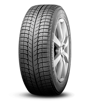 A close-up of a tire displayed against a solid black background, highlighting its tread and design features